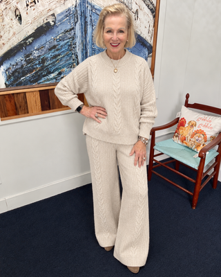 Coco and Carmen oatmeal cable knit sweater and matching pants on boutique model