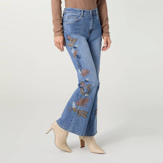 Coco + Carmen Bambu Soft Flare jeans with leaf embroidery in medium denim