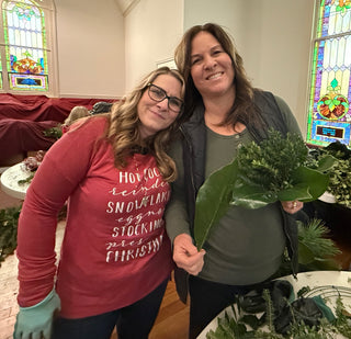 Holiday greens wreath workshop — participants creating fresh evergreen wreaths