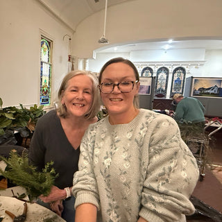 Holiday greens wreath workshop — participants creating fresh evergreen wreaths