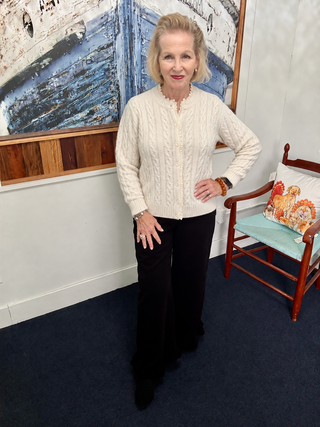 Urban Daizy Ivory Cable-Knit Cardigan with Lace Ruffle Trim modeled by Vickie at Savvie’s Blue Shell Boutique